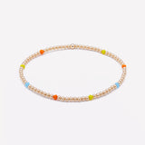 Yellow gold beaded bracelet with rainbow crystals for women