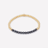 Yellow gold beaded bracelet with hematite row for women