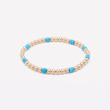 Yellow gold beaded bracelet with turquoise nuggets for women