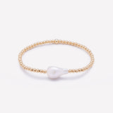 Yellow gold beaded bracelet with baroque pearl for women