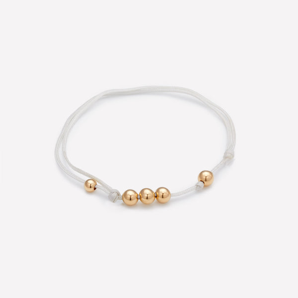 Grey silk string bracelet with yellow gold beads for men and women