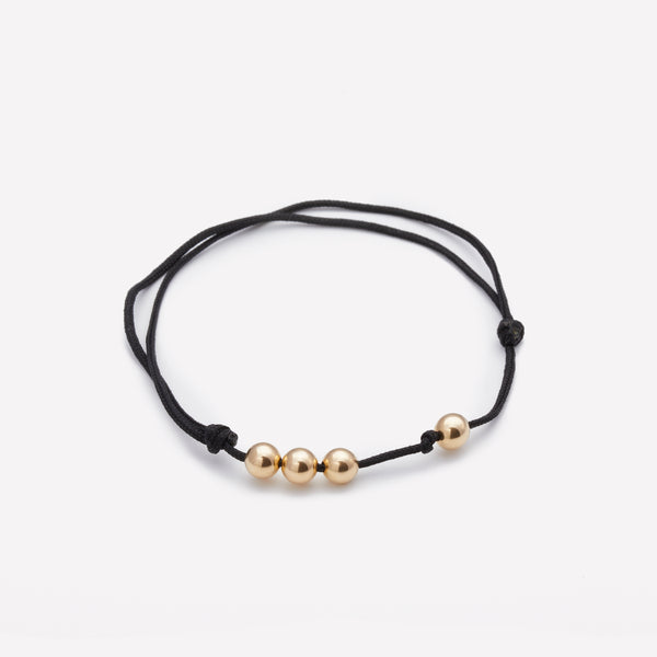 Black string bracelet with yellow gold beads for men and women