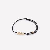 Black string bracelet with yellow gold beads for kids