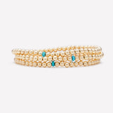 Yellow gold beaded anklet with single turquoise crystal stack for women
