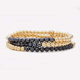 Yellow gold beaded bracelet with hematite row stack for women