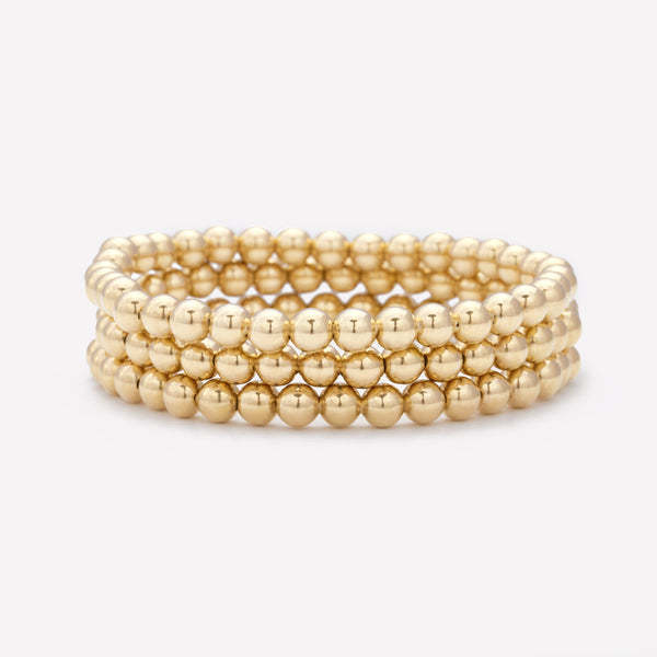 Yellow gold beaded bracelet stack for women