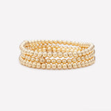 Yellow gold beaded bracelet stack for women