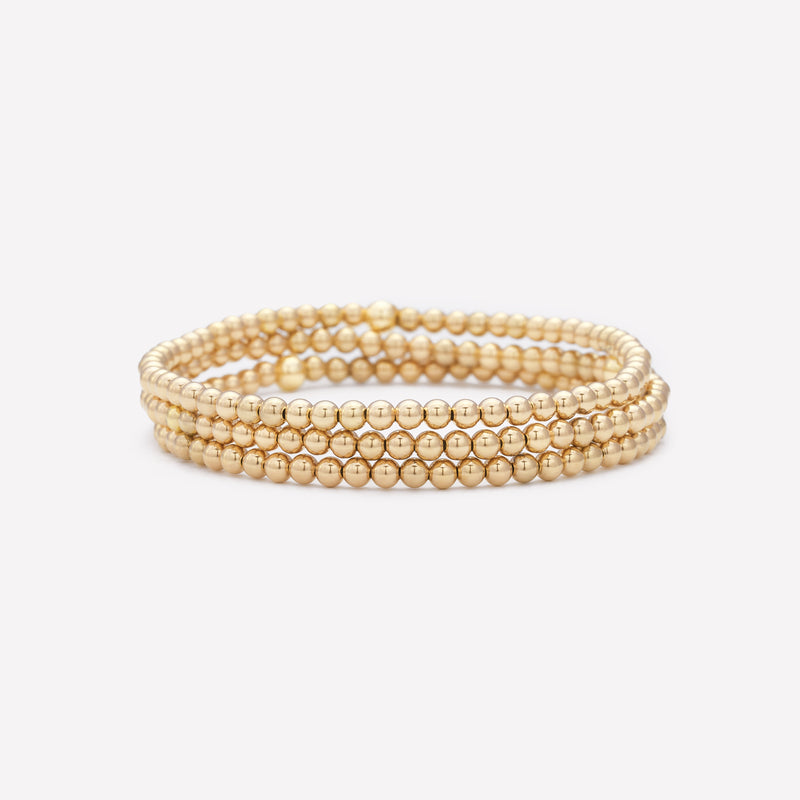 Yellow gold beaded bracelet stack for women