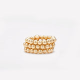 Yellow gold beaded ring stack for women
