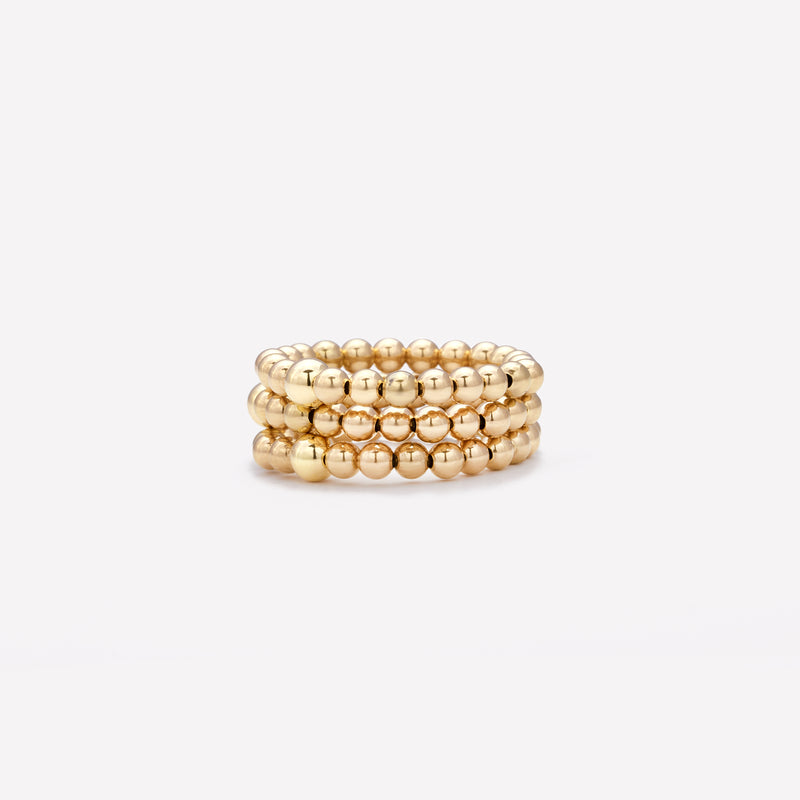 Yellow gold beaded ring stack for women