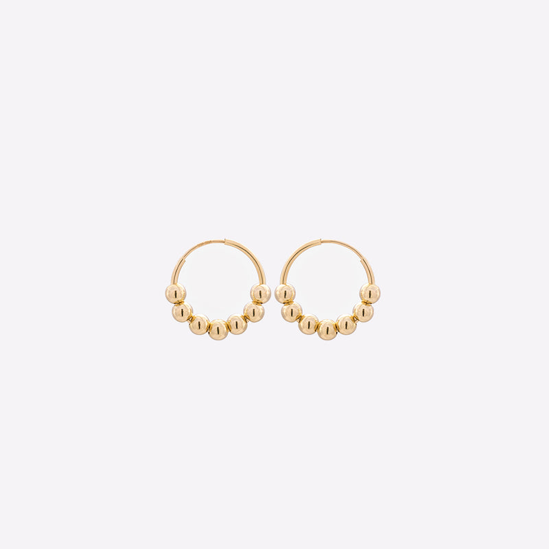 Yellow gold small hoop earrings with gold beads for kids