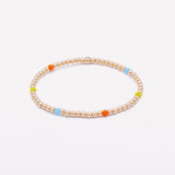 Yellow gold beaded bracelet with rainbow crystals for women